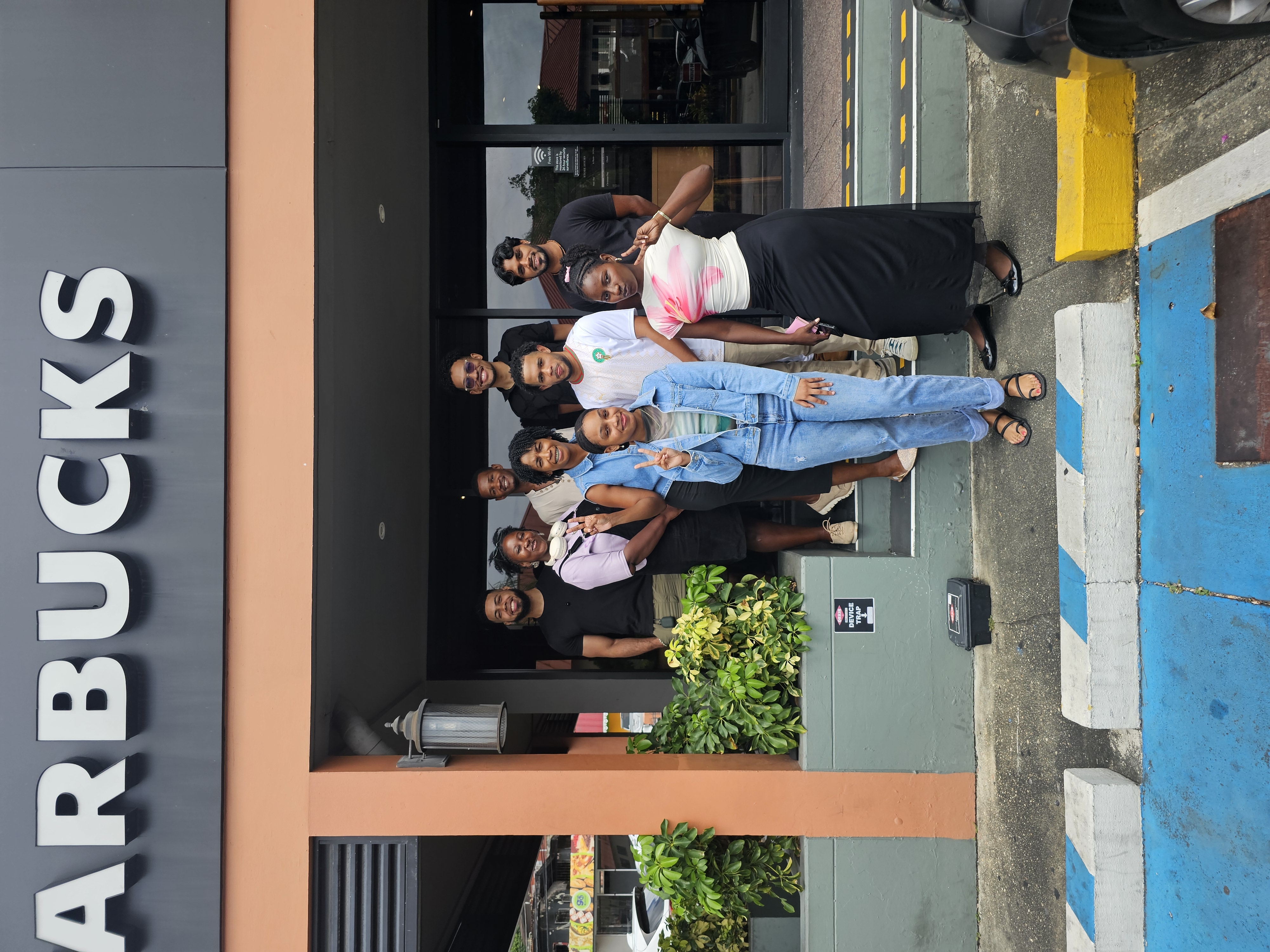 Lingua members standing outside of starbucks